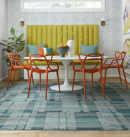 Dining room with FLOR Be Cool area rug in Teal